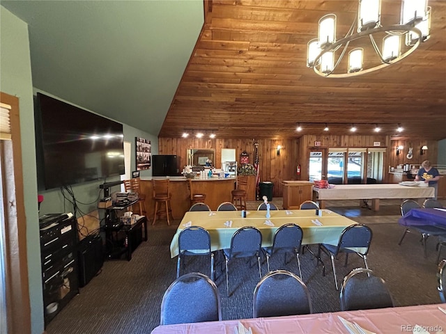 16 Scott Dr N, Broomfield, CO 80020 - dining room featuring dark colored carpet, a chandelier, and wood ceiling