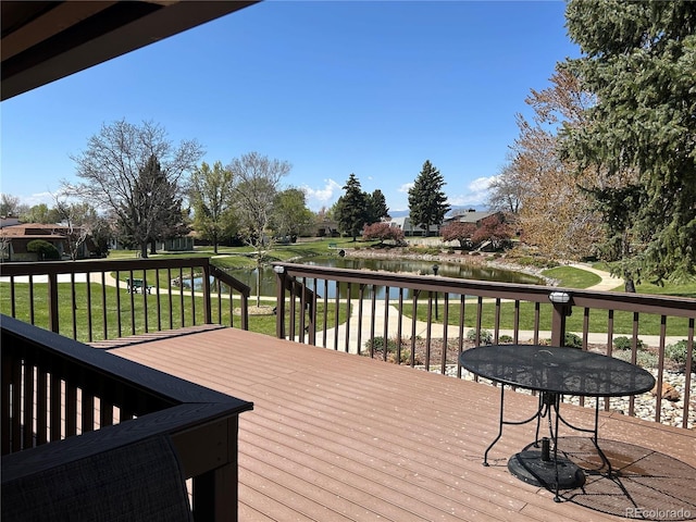16 Scott Dr N, Broomfield, CO 80020 - wooden terrace featuring a water view and a lawn