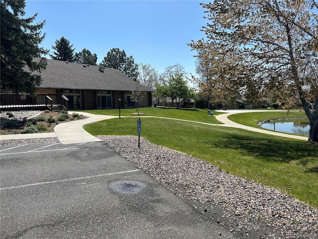 16 Scott Dr N, Broomfield, CO 80020 - view of property's community featuring a yard and a deck with water view