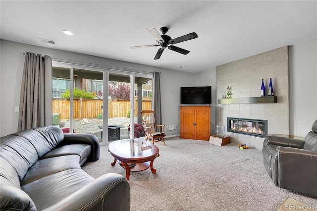 9635 Bellaire Ln, Thornton, CO 80229 - carpeted living area featuring a fireplace, a ceiling fan, and recessed lighting
