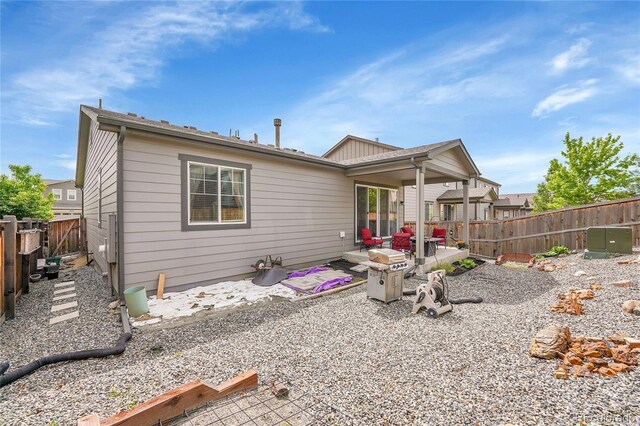 9635 Bellaire Ln, Thornton, CO 80229 - rear view of house with a patio and a fenced backyard