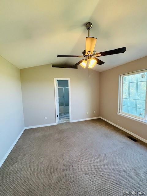 12225 E 2nd Dr, Aurora, CO 80011 - unfurnished room with ceiling fan, carpet, and lofted ceiling