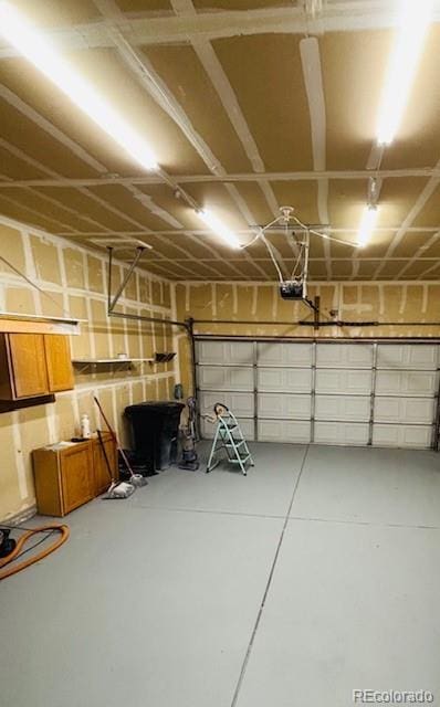 12225 E 2nd Dr, Aurora, CO 80011 - garage featuring a garage door opener
