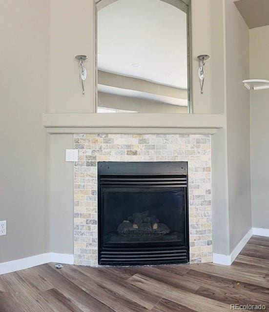 12225 E 2nd Dr, Aurora, CO 80011 - detailed view of wood finished floors and a glass covered fireplace