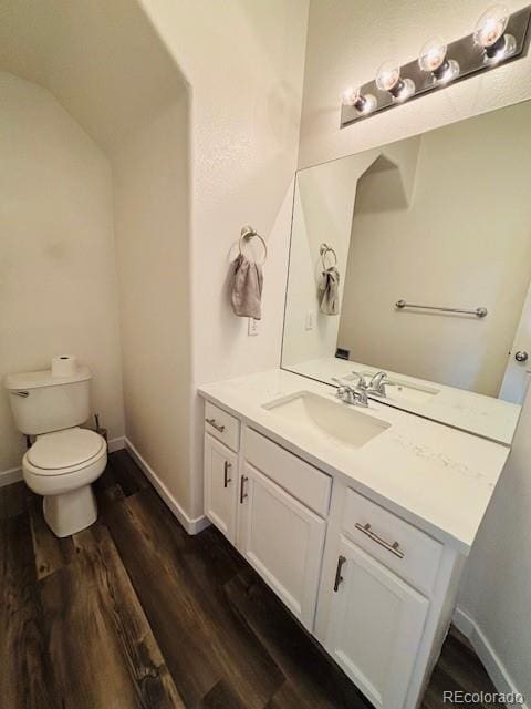 12225 E 2nd Dr, Aurora, CO 80011 - half bathroom with vanity and wood finished floors