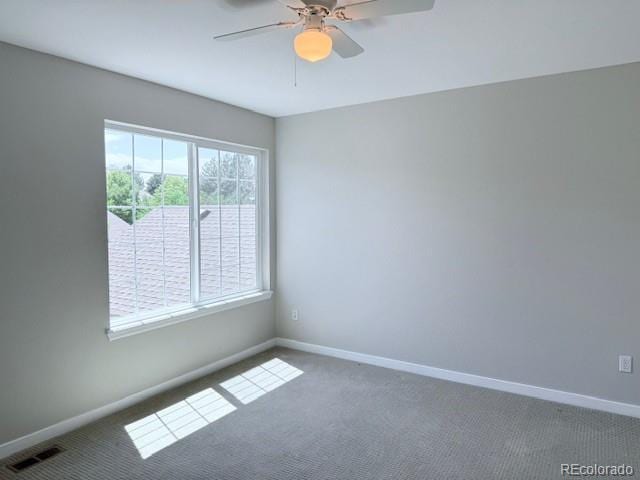 12225 E 2nd Dr, Aurora, CO 80011 - carpeted spare room with a ceiling fan and baseboards