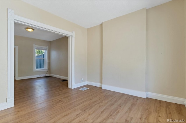 unfurnished room featuring light hardwood / wood-style floors