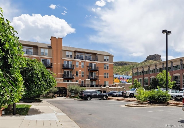 620 11th St Unit 206, Golden, CO 80401 - view of apartment building / complex featuring uncovered parking