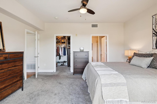 620 11th St Unit 206, Golden, CO 80401 - bedroom with carpet floors, a walk in closet, and a ceiling fan