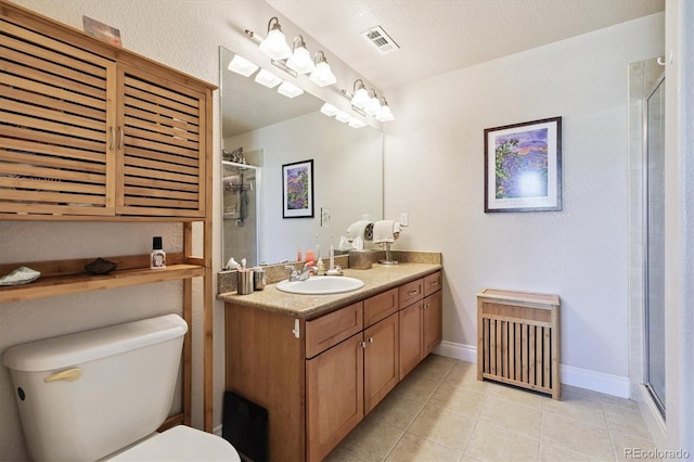 620 11th St Unit 206, Golden, CO 80401 - bathroom with vanity, tile patterned flooring, and a shower with door