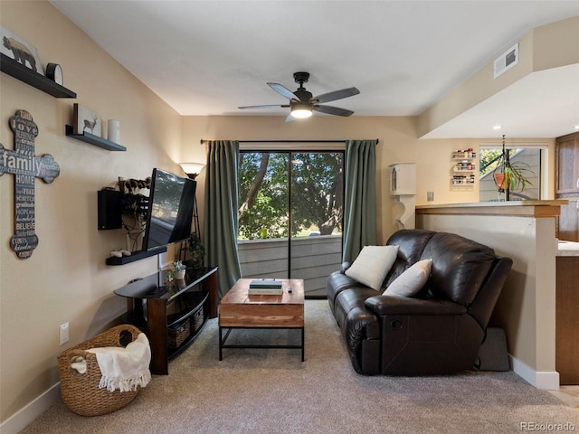 12476 W Nevada Pl Unit 106, Lakewood, CO 80228 - carpeted living room with ceiling fan and baseboards