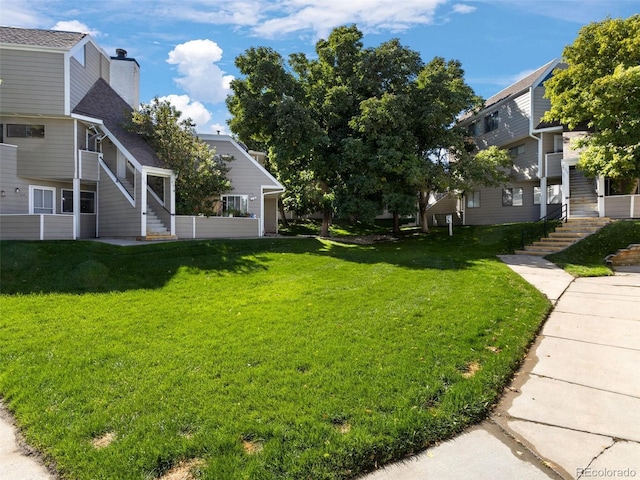 12476 W Nevada Pl Unit 106, Lakewood, CO 80228 - view of grassy yard featuring stairway