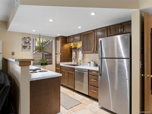12476 W Nevada Pl Unit 106, Lakewood, CO 80228 - kitchen with appliances with stainless steel finishes, a sink, light countertops, recessed lighting, and light tile patterned flooring