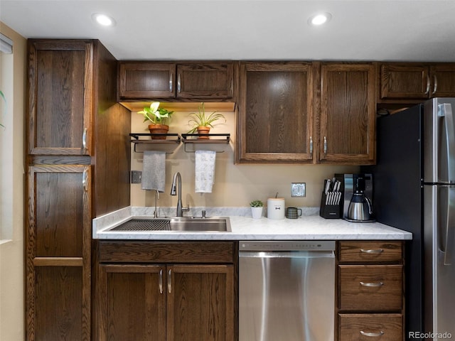 12476 W Nevada Pl Unit 106, Lakewood, CO 80228 - kitchen featuring appliances with stainless steel finishes, a sink, light countertops, recessed lighting, and dark brown cabinetry