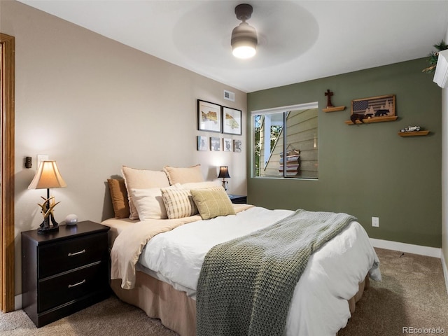 12476 W Nevada Pl Unit 106, Lakewood, CO 80228 - bedroom featuring carpet flooring, baseboards, and a ceiling fan