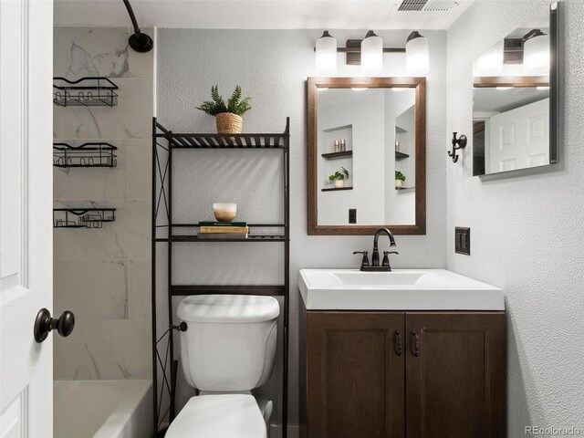 12476 W Nevada Pl Unit 106, Lakewood, CO 80228 - full bath with toilet, vanity, a textured wall, and bathing tub / shower combination