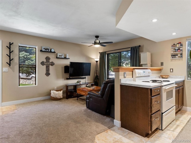 12476 W Nevada Pl Unit 106, Lakewood, CO 80228 - kitchen with white range with electric stovetop, open floor plan, light countertops, a ceiling fan, and recessed lighting