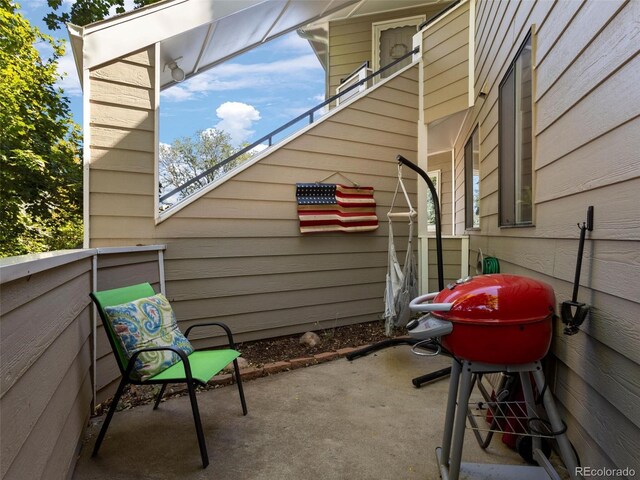 12476 W Nevada Pl Unit 106, Lakewood, CO 80228 - view of home's exterior with a patio