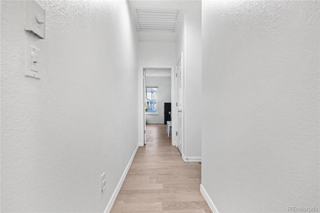 corridor featuring light hardwood / wood-style flooring