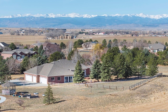 birds eye view of property with a rural view and a mountain view