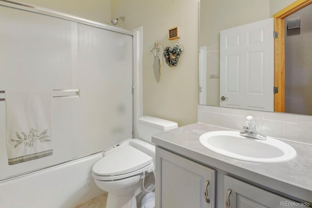 bathroom featuring shower / bath combination with glass door, vanity, toilet, visible vents, and decorative backsplash