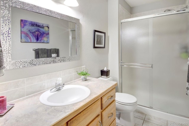 bathroom with toilet, decorative backsplash, a shower stall, and tile patterned flooring