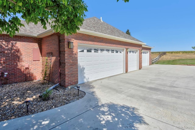 garage featuring driveway