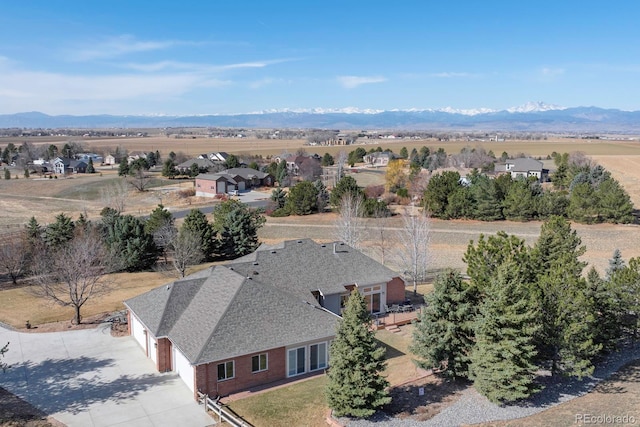 birds eye view of property featuring a mountain view