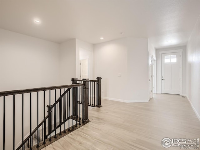 hallway featuring light hardwood / wood-style flooring