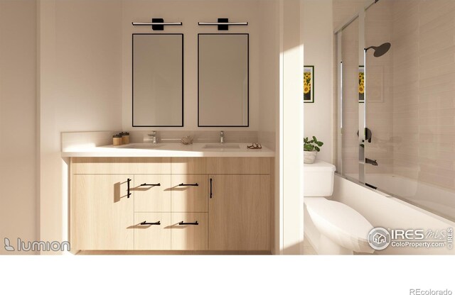 full bathroom with combined bath / shower with glass door, dual bowl vanity, and toilet