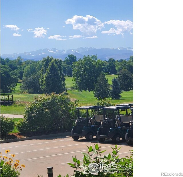 view of tennis court featuring a mountain view