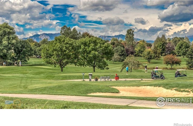 2305 Glacier Ct, Lafayette, CO 80026 - view of property's community with a yard, a mountain view, and view of golf course