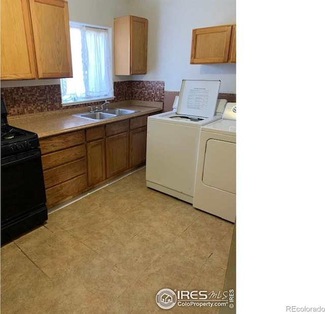 interior space featuring sink and separate washer and dryer