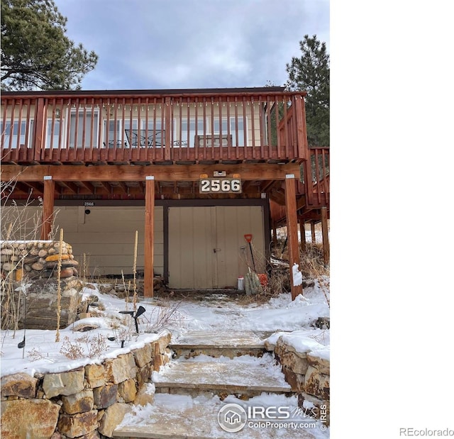 view of snow covered garage