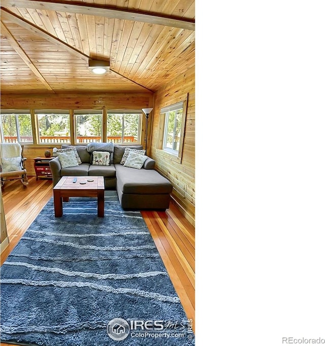 living room featuring wooden ceiling, wood-type flooring, and vaulted ceiling