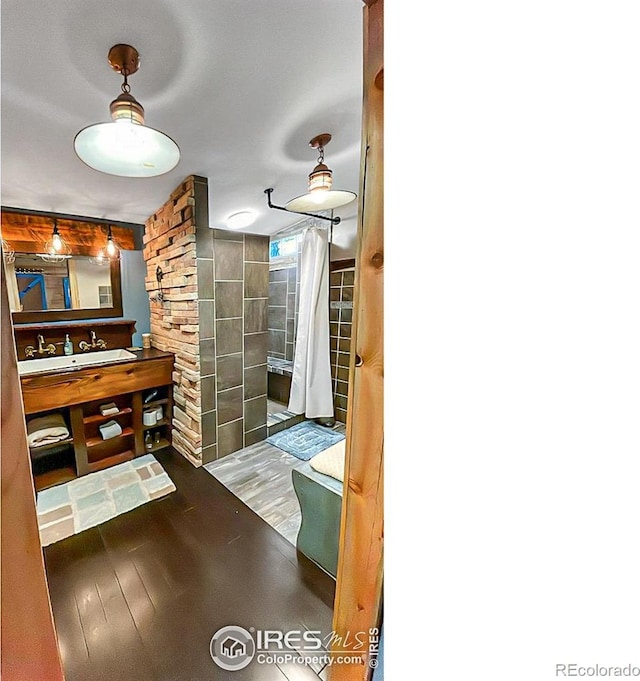 interior space with hardwood / wood-style floors and sink