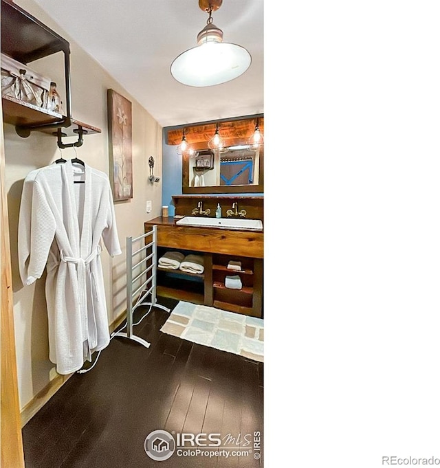 bathroom featuring wood-type flooring and vanity