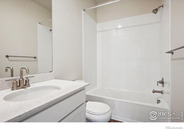 bathroom featuring shower / bathing tub combination, toilet, and vanity