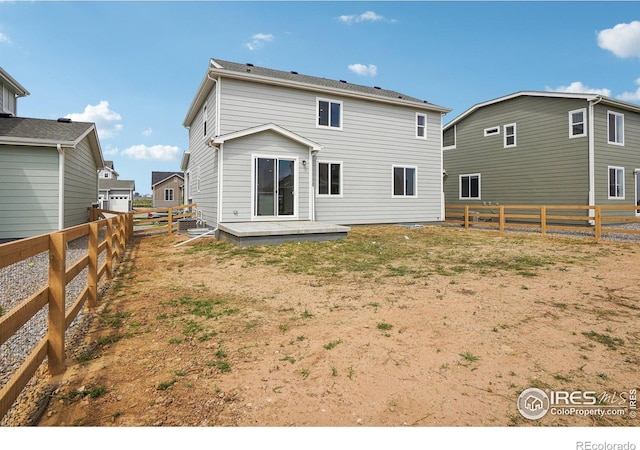 back of property with a patio area and a fenced backyard