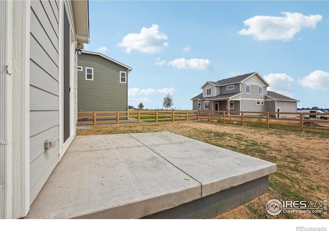 view of yard with a patio area and a fenced backyard