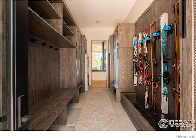 mudroom with light tile patterned flooring