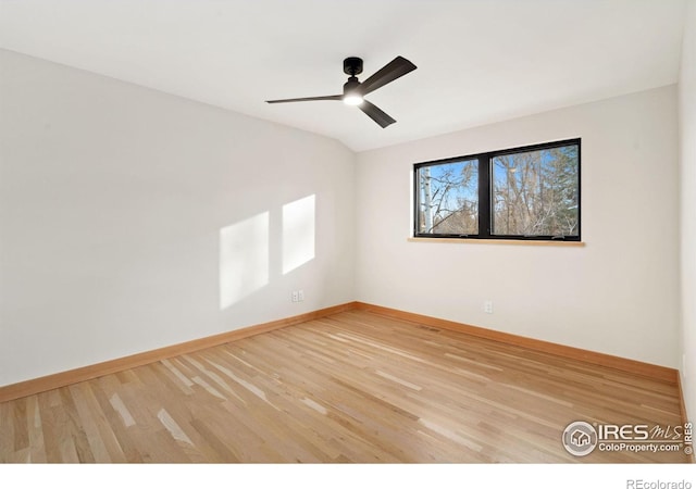 spare room featuring ceiling fan and light hardwood / wood-style flooring