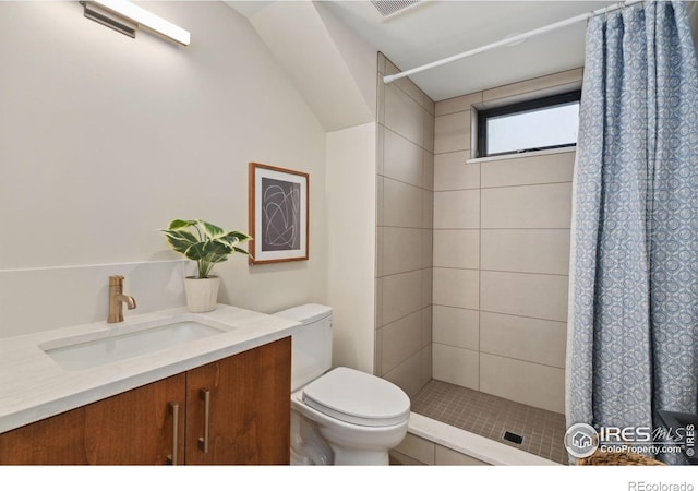 bathroom featuring a shower with curtain, toilet, and vanity