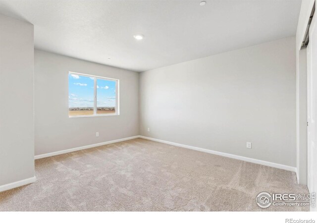 spare room with carpet flooring