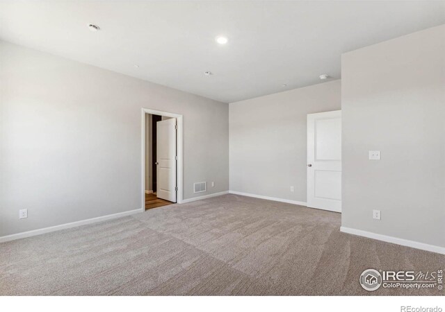 unfurnished room with carpet