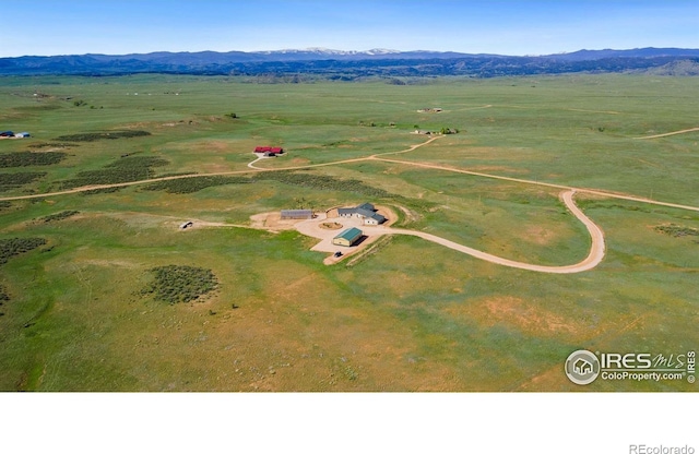 drone / aerial view featuring a mountain view and a rural view