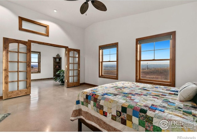 bedroom with ceiling fan, lofted ceiling, and french doors