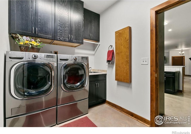 laundry room featuring cabinets and independent washer and dryer