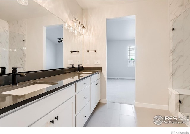 bathroom featuring dual sinks, oversized vanity, and tile flooring