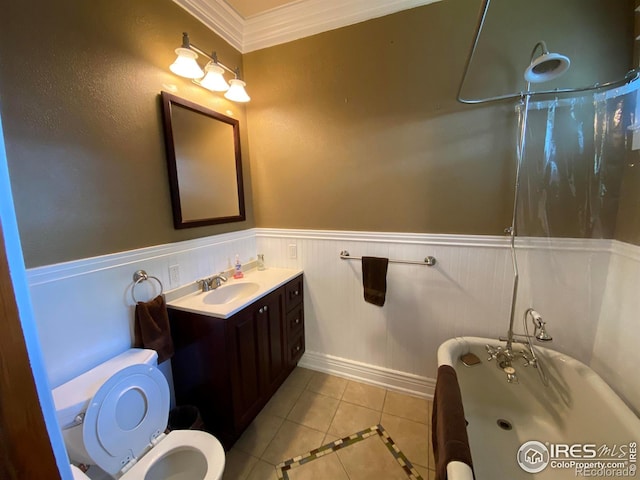 bathroom with tile patterned floors, toilet, a shower with curtain, crown molding, and vanity